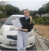 West Coast Driving School learner holding a certificate